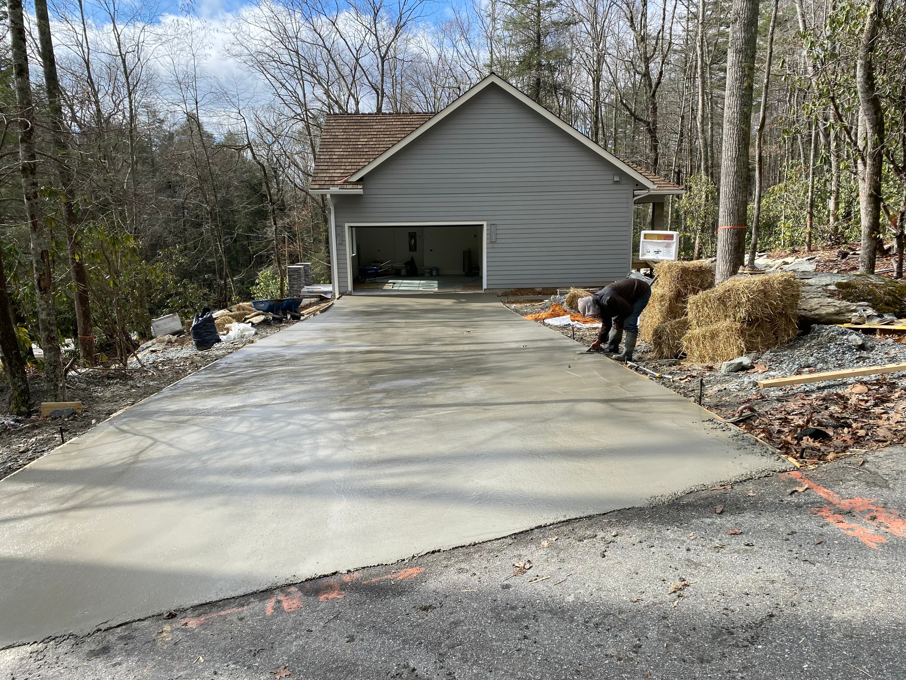 Finished concrete driveway with the home in view